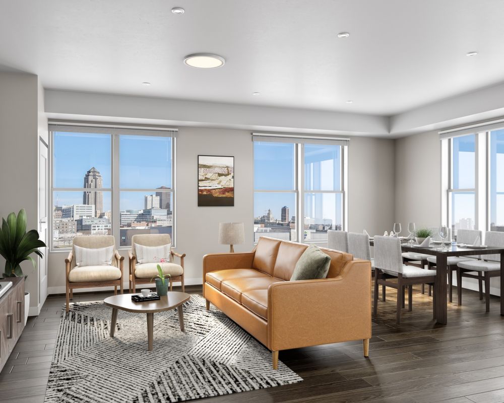 rendering of apartment living area with couch, coffee table, and dining furniture at Slate 55+ luxury apartments