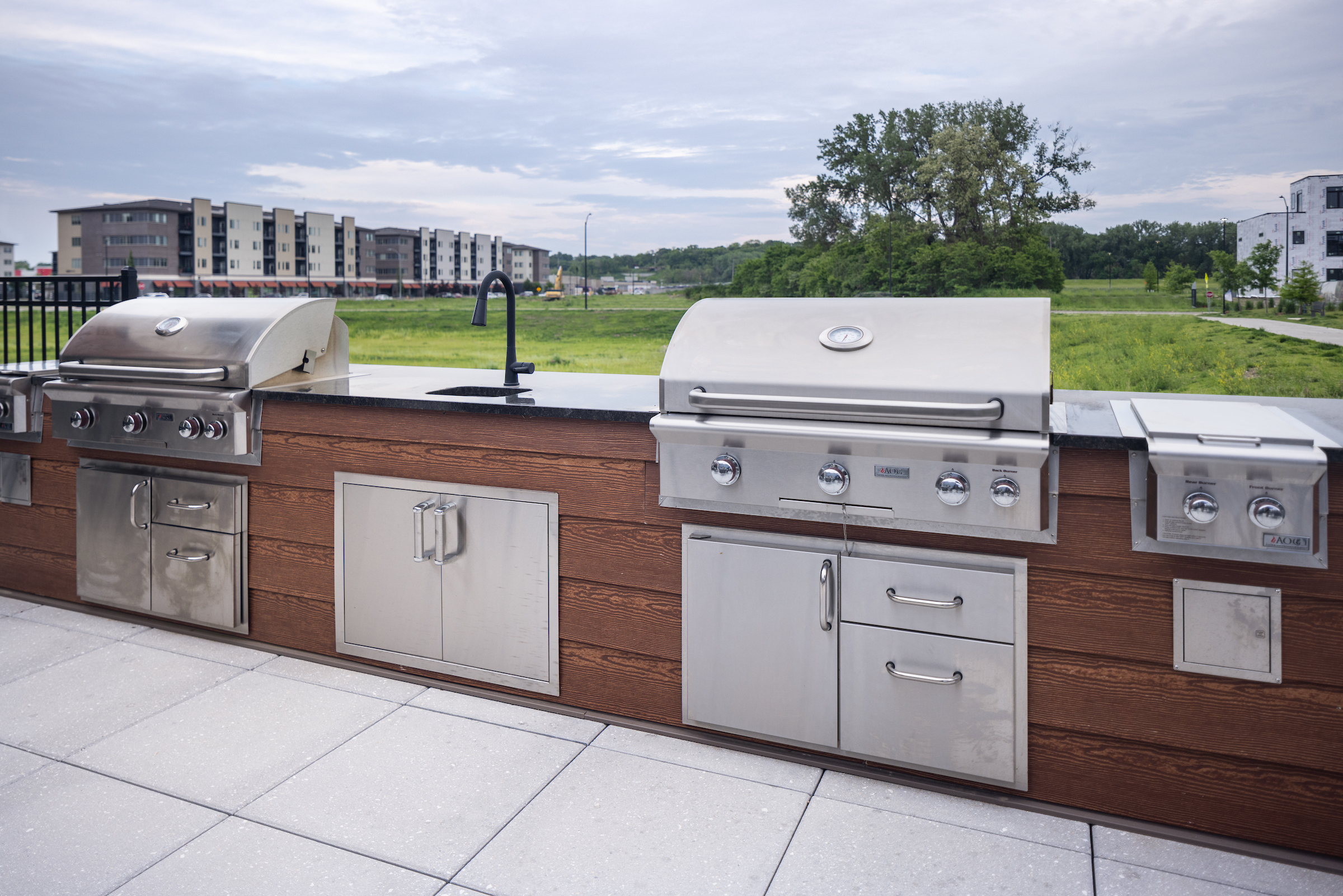 Slate apartments state-of-the-art-outdoor grilling area on the resident deck.